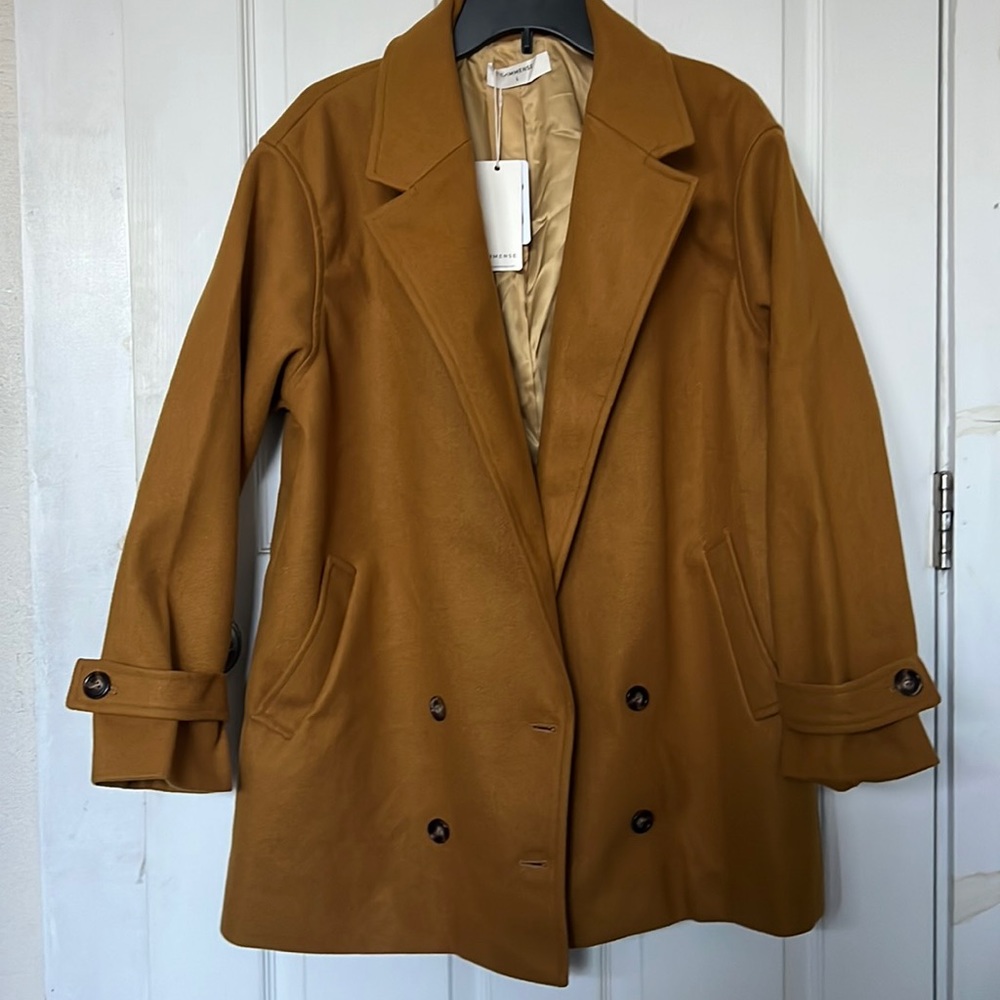 Large and dark mustard colored coat. Size: Length 22.5 in. and height 31 in.